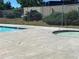 Community pool area featuring an inground pool and jacuzzi tub area at 100 E Highline Cir # 105, Centennial, CO 80122
