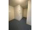 Storage room with individual locked cabinets with numbers on them and concrete flooring at 100 E Highline Cir # 105, Centennial, CO 80122