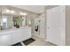 Elegant bathroom with double vanity and walk-in shower at 847 Ledge St, Lochbuie, CO 80603