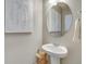 Simple bathroom with pedestal sink and oval mirror at 847 Ledge St, Lochbuie, CO 80603
