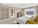 Main bedroom with large window and ensuite bathroom at 847 Ledge St, Lochbuie, CO 80603
