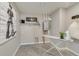Laundry room with ironing board and storage at 847 Ledge St, Lochbuie, CO 80603