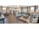 Open concept living area with hardwood floors and a cozy seating area at 847 Ledge St, Lochbuie, CO 80603