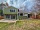 The backyard features a well-kept lawn, sliding glass doors, patio, and solar panels on the roof at 6640 S Heritage W Pl, Centennial, CO 80111