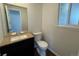 Powder room featuring granite counters and dark wood cabinetry at 6640 S Heritage W Pl, Centennial, CO 80111