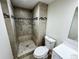 Modern bathroom features a step-in shower with mosaic tile accents at 6640 S Heritage W Pl, Centennial, CO 80111