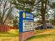 Neighborhood elementary school with well-maintained lawn, mature trees at 6640 S Heritage W Pl, Centennial, CO 80111