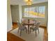 Dining room with space for four and large window to enjoy the views of the backyard at 6640 S Heritage W Pl, Centennial, CO 80111