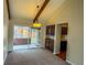 A dining area with an exposed beam ceiling and sliding glass doors to a covered patio at 6640 S Heritage W Pl, Centennial, CO 80111