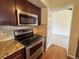 Updated kitchen features stainless steel appliances and granite countertops at 6640 S Heritage W Pl, Centennial, CO 80111