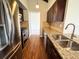 Modern kitchen featuring stainless steel appliances, granite counters and hardwood floors at 6640 S Heritage W Pl, Centennial, CO 80111