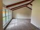 A bright and airy living room featuring vaulted ceilings and large windows at 6640 S Heritage W Pl, Centennial, CO 80111