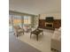 Living room features a brick fireplace, shelving, and sliding glass doors to the backyard at 6640 S Heritage W Pl, Centennial, CO 80111