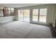 Bright living room with large windows and sliding door to the backyard at 6640 S Heritage W Pl, Centennial, CO 80111