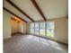 Bright living room with large windows and exposed beams creates an open and inviting space at 6640 S Heritage W Pl, Centennial, CO 80111