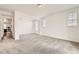Bright and airy bedroom with neutral carpet and two windows at 17632 Datura St, Broomfield, CO 80023