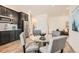 Stylish dining area with a glass table, seating for four, and modern finishes at 17632 Datura St, Broomfield, CO 80023
