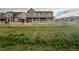 Two-story home with a charming porch and fenced yard, backing to open space at 17632 Datura St, Broomfield, CO 80023