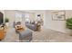 Virtually staged living room showcasing neutral decor, comfortable seating, and ample natural light at 17632 Datura St, Broomfield, CO 80023