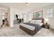 Spacious main bedroom with a work space and neutral decor. Virtually Staged at 17632 Datura St, Broomfield, CO 80023