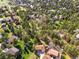 Aerial view of a neighborhood with mature trees and well-maintained homes at 8409 Lightening View Dr, Parker, CO 80134