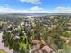 An aerial view showcasing a home nestled within a vibrant, tree-filled residential area at 8409 Lightening View Dr, Parker, CO 80134