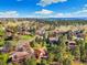 Aerial view of homes surrounded by green trees and blue sky at 8409 Lightening View Dr, Parker, CO 80134