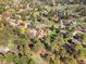 Aerial view of neighborhood homes surrounded by lush trees and greenery, showcasing a serene and private setting at 8409 Lightening View Dr, Parker, CO 80134