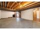 Unfinished basement offers an open layout with concrete floors and exposed beams, ready for customization at 8409 Lightening View Dr, Parker, CO 80134