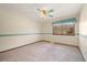 Bright bedroom with a ceiling fan, window, light paint and neutral carpet at 8409 Lightening View Dr, Parker, CO 80134