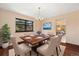 Dining room with hardwood floors, large window, and seating for six at 8409 Lightening View Dr, Parker, CO 80134