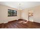 Bright dining room with hardwood floors, chandelier, and large window view at 8409 Lightening View Dr, Parker, CO 80134