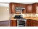 Modern kitchen featuring stainless steel appliances, granite countertops, and custom cabinetry at 8409 Lightening View Dr, Parker, CO 80134