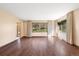 Spacious living room with hardwood floors, natural light, and neutral color palette at 8409 Lightening View Dr, Parker, CO 80134