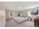 Main bedroom with a comfortable bed, natural lighting, and neutral decor at 8409 Lightening View Dr, Parker, CO 80134