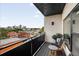 Balcony featuring outdoor seating, plants, and a distant cityscape view at 2880 Zuni St # 309, Denver, CO 80211