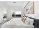 Bright bedroom featuring a large window with neighborhood views and modern, stylish decor at 2880 Zuni St # 309, Denver, CO 80211