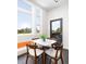 Inviting dining area with city views, a modern table, and seating for four at 2880 Zuni St # 309, Denver, CO 80211