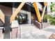 The entrance to the building features a modern doorway, with brick accents and updated signage at 2880 Zuni St # 309, Denver, CO 80211