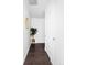 Clean hallway with white walls, wood floors, and minimalist design at 2880 Zuni St # 309, Denver, CO 80211