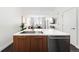 Modern kitchen with a stainless steel dishwasher, and light countertops, providing ample workspace at 2880 Zuni St # 309, Denver, CO 80211
