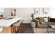 A stylish living room featuring a modern kitchen island, comfortable seating, and elegant decor at 2880 Zuni St # 309, Denver, CO 80211