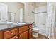 Bathroom featuring a single vanity, tile flooring, and a shower and tub combo at 6284 Orion Ct # B, Arvada, CO 80403
