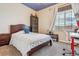 Bedroom featuring a starry night ceiling, carpet flooring, and a large window at 6284 Orion Ct # B, Arvada, CO 80403