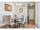 Cozy dining room featuring a round table, chandelier, and light-colored walls at 6284 Orion Ct # B, Arvada, CO 80403