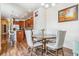 Open floor plan with a dining room flowing into the kitchen, creating a bright and inviting atmosphere at 6284 Orion Ct # B, Arvada, CO 80403