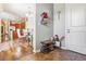 Foyer area featuring a shoe rack, tile flooring, and view to the kitchen at 6284 Orion Ct # B, Arvada, CO 80403