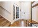 Inviting entryway featuring tiled floors, a coat rack, and access to the upper level at 6284 Orion Ct # B, Arvada, CO 80403