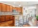 Modern kitchen with stainless steel appliances, a mosaic tile backsplash, and bar stool seating at 6284 Orion Ct # B, Arvada, CO 80403