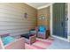 Cozy covered front porch with outdoor seating, perfect for relaxing at 6284 Orion Ct # B, Arvada, CO 80403